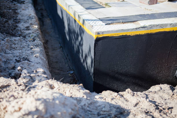 Professional Emergency Waterproofing technician working in Auburn, MI